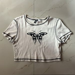 A symmetrical butterfly design crop top