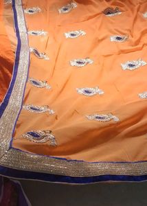 Orange Saree with Blue Velvet Blouse
