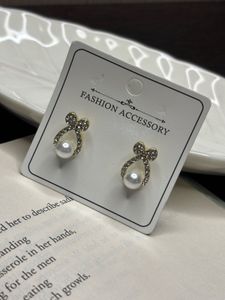 Elegant Pearl & Crystal Bow Earrings
