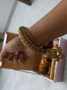 Elegant Gold Tone Bangle with Tassel