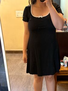 Chic Black Ribbed Mini Dress with Bow Accent