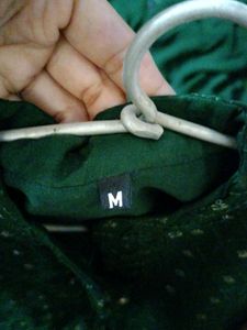 M size long flared cut out bottle green kurti