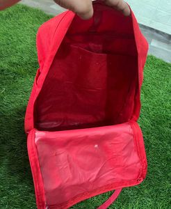 Kanken Fjallraven red backpack