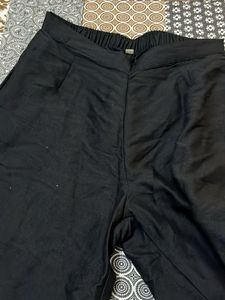 Elegant Black Palazzos with Embroidered Hem