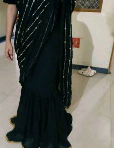 Elegant Black Saree with Golden Embellishments
