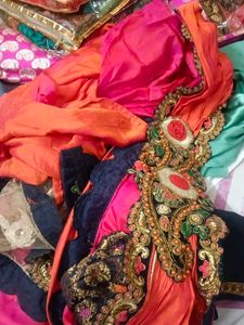 Vibrant Orange Saree with Intricate Embroidery