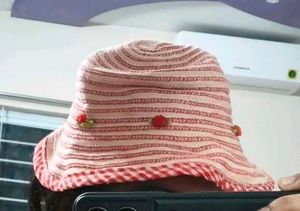 Red & White Striped Bucket Hat with Flower Accents