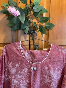 mauve suit With subtle, intricate floral print