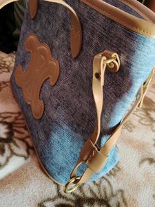 Stylish Denim Handbag with Leather Accents