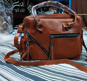 Stylish Brown Leather Handbag with Tassels