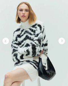 Black hobo bag with metal chain