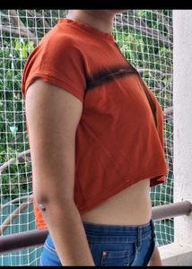 Edgy Orange Graphic Crop Top