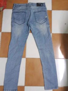 Light Wash Distressed Denim Jeans