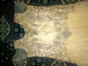 Elegant Cream Gown with Embellished Bodice