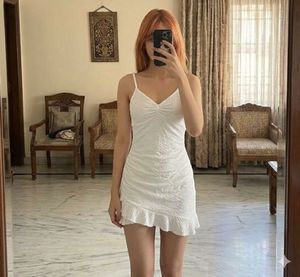 Chic White Textured Midi Dress with Ruffle Hem