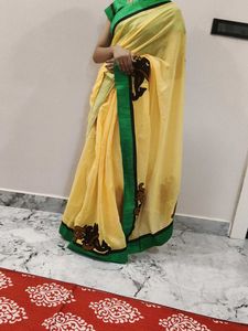 Elegant Yellow Saree with Green Border