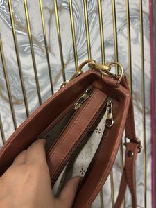 Chic Brown Handbag with Gold Chain Strap