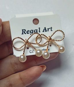 Bow Pearl golden stude Earrings