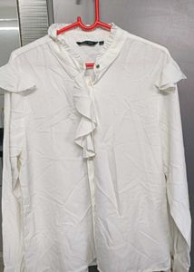 Chic White Ruffle Front Top of westside brand