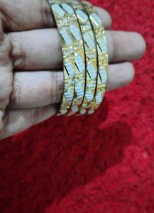 Elegant Gold Tone Bangles Set