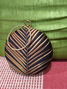 Round Leaf Print Clutch with Rhinestone Handle