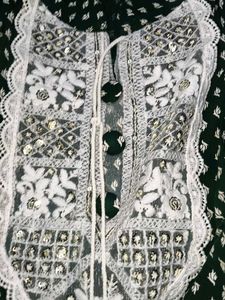 A beautiful dark green short kurti with embellish