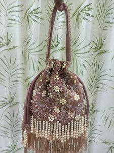 Embroidered clutch