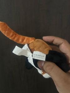 cute red panda plush keychain with a white