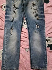 Distressed Blue Denim Jeans