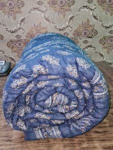 Blue Patterned Quilt Wait 1.850