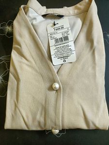 Elegant Beige Wrap Top with Pearl Button