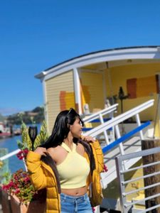 A yellow crop off-shoulder top