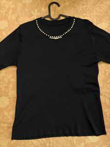Elegant Black Top with Pearl Embellishment