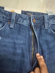 Distressed Blue Denim Jeans