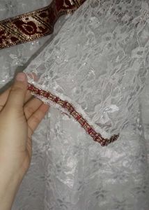 Elegant White Lace Gown with Red Trim