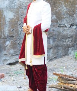Men’s white sherwani with red velvet dhoti