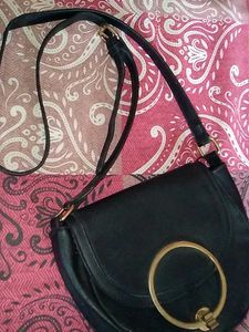 Chic Black Crossbody Bag with Gold Ring Detail