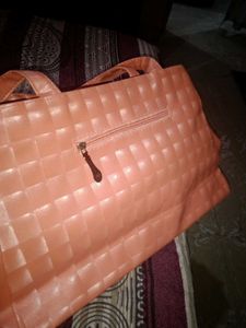 Chic Peach Textured Handbag