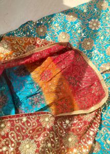 Stunning Teal Saree with Intricate Embellishments