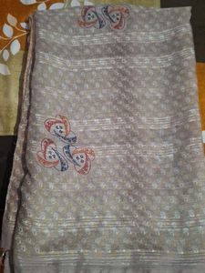 Elegant Beige Saree with Intricate Pattern