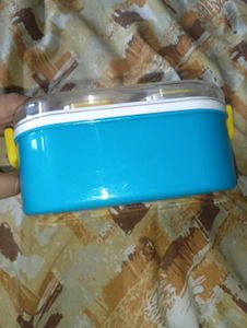 a lunch box in blue and white colour