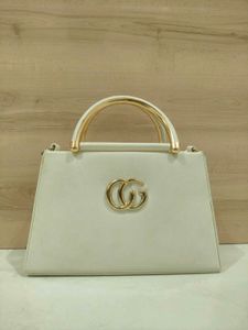 Elegant Cream Handbag with Gold Accents