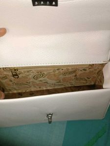 chic white sling and handbag