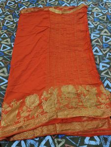 Vibrant Orange Saree with Gold Border