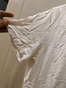 white tee with beeded pocket style