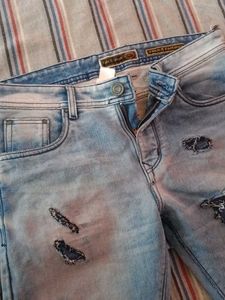 Distressed Light Wash Denim Jeans