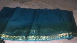 Elegant Teal Saree with Traditional Print