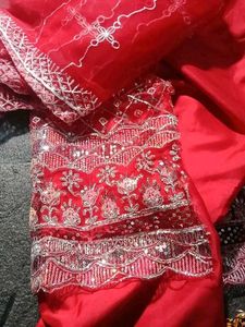Red dress material with embroidery work