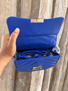 Blue sling purse