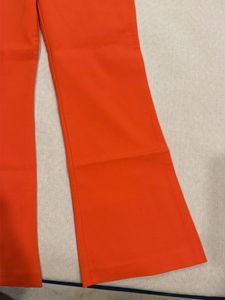 Vibrant Orange Cut-Out Top with pants